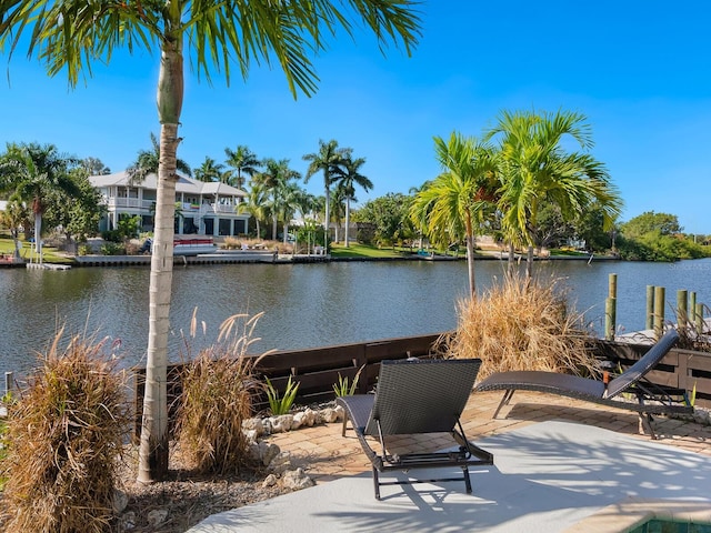 property view of water with a dock