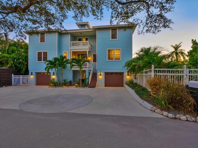 view of front of house with a garage and a balcony