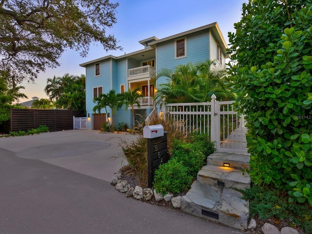 view of front of house with a balcony and a garage