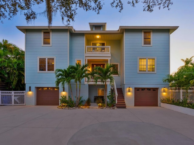 view of front of house with a balcony and a garage