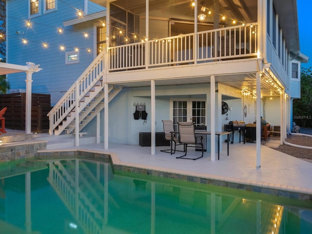 view of pool featuring area for grilling and a patio area