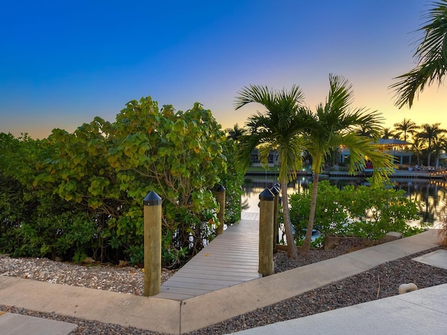 surrounding community featuring a water view