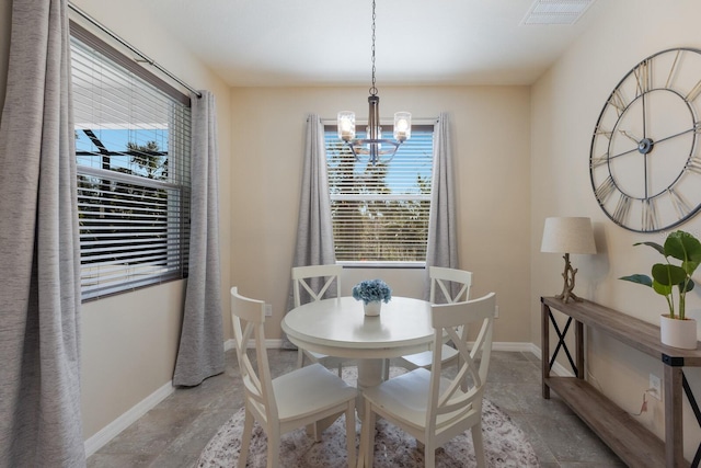 dining space with a notable chandelier