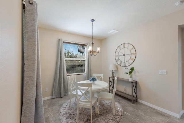 dining area featuring a chandelier