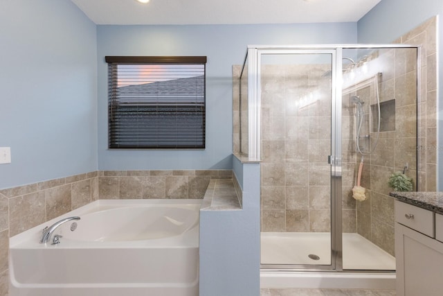 bathroom with independent shower and bath and vanity