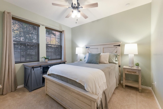 bedroom featuring ceiling fan and light colored carpet