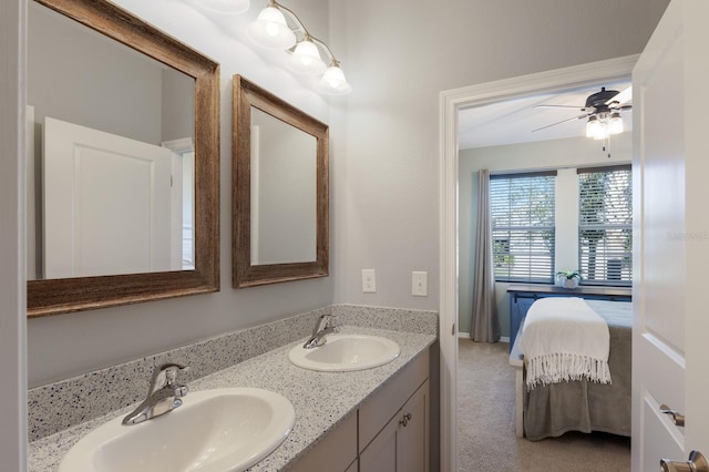 bathroom featuring ceiling fan and vanity