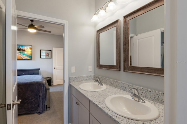 bathroom featuring ceiling fan and vanity