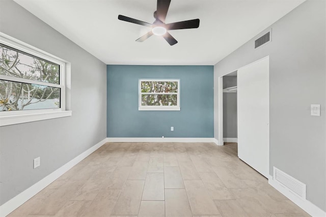 unfurnished bedroom featuring a closet and ceiling fan