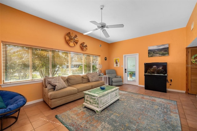 tiled living room with ceiling fan