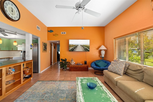 living room with ceiling fan and light tile patterned floors