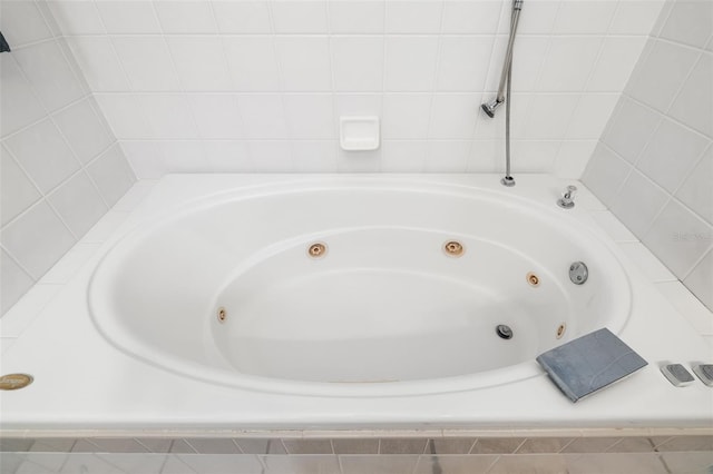 bathroom with tiled tub