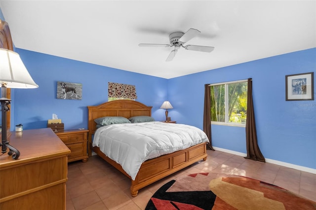 tiled bedroom with ceiling fan