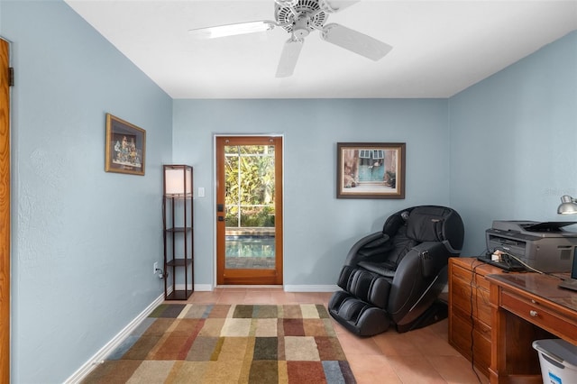 sitting room with ceiling fan and light tile patterned floors