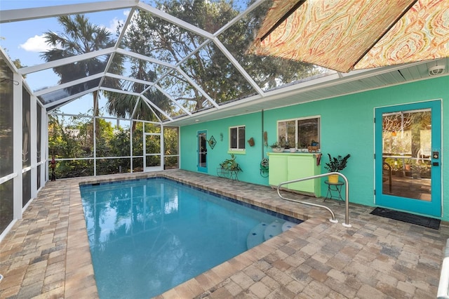 view of pool featuring a lanai and a patio area