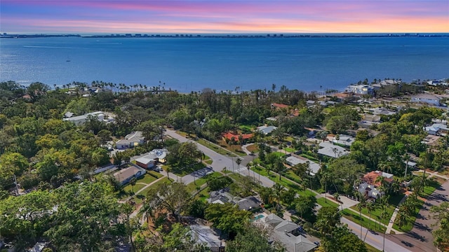 aerial view at dusk with a water view