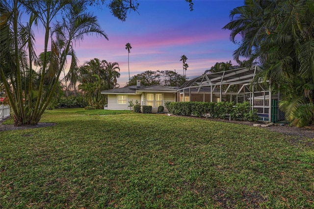 yard at dusk with a lanai