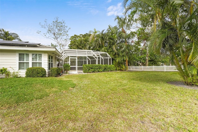 view of yard featuring glass enclosure