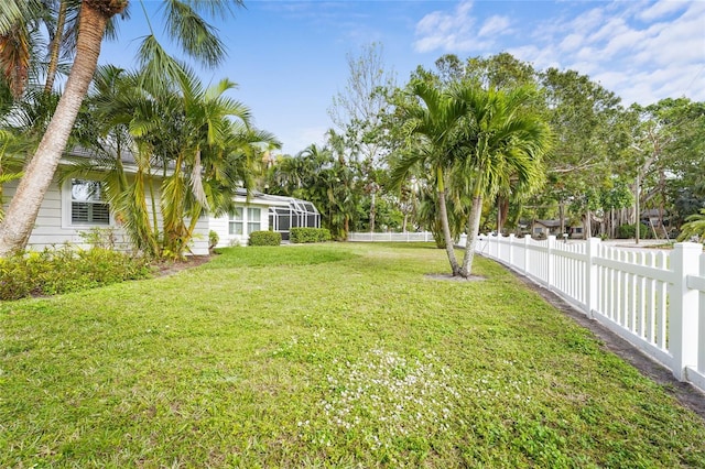 view of yard featuring a lanai