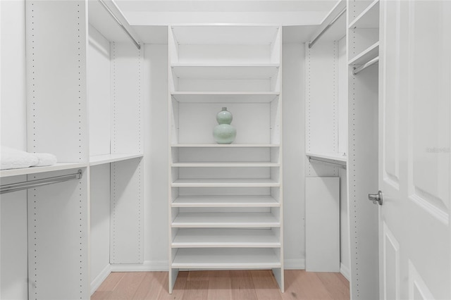 walk in closet featuring light wood-type flooring