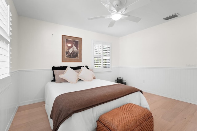 bedroom with light wood-type flooring and ceiling fan