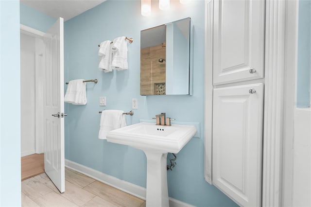 bathroom featuring a shower and sink