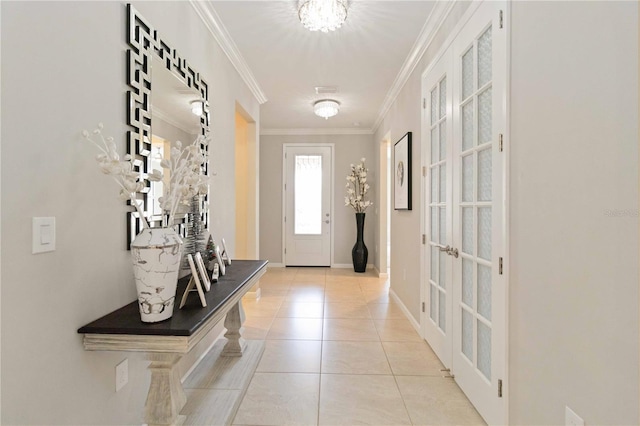 entryway featuring crown molding, french doors, and light tile patterned floors