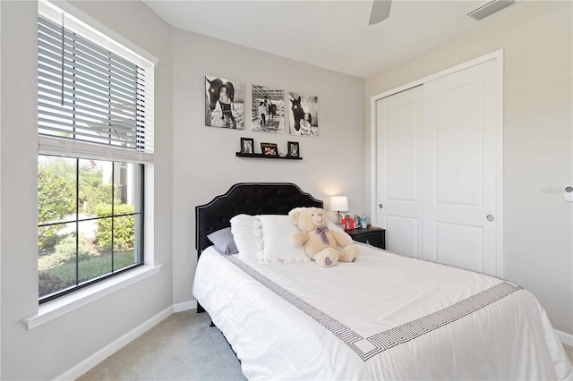 bedroom featuring ceiling fan, carpet floors, and a closet