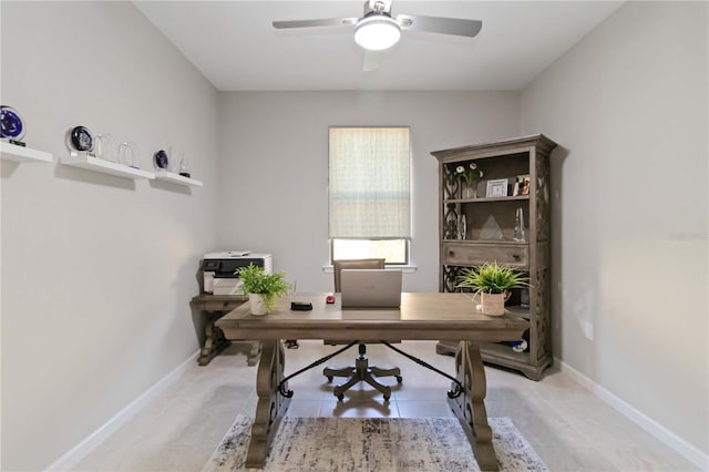 tiled office space with ceiling fan