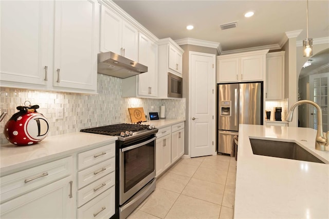 kitchen with white cabinetry, sink, light tile patterned flooring, and appliances with stainless steel finishes