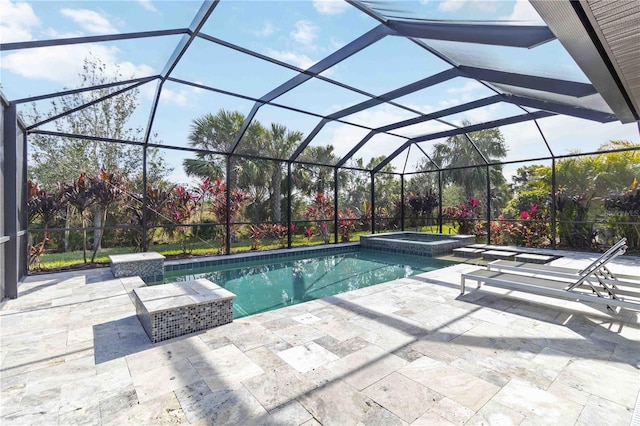 view of pool featuring a patio area, a lanai, and an in ground hot tub