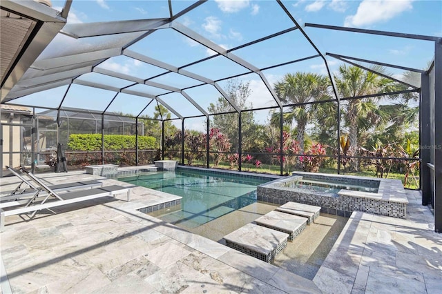 view of swimming pool with an in ground hot tub, glass enclosure, and a patio area