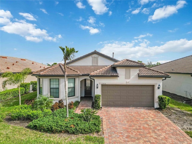 mediterranean / spanish-style home featuring a garage