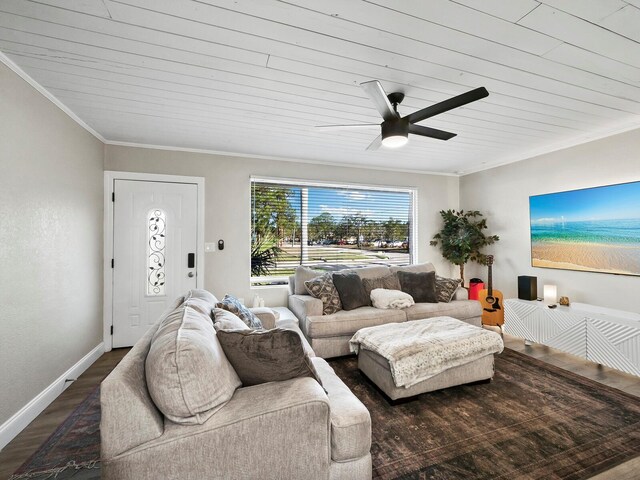 living room featuring ornamental molding, ceiling fan, dark wood-type flooring, and wood ceiling