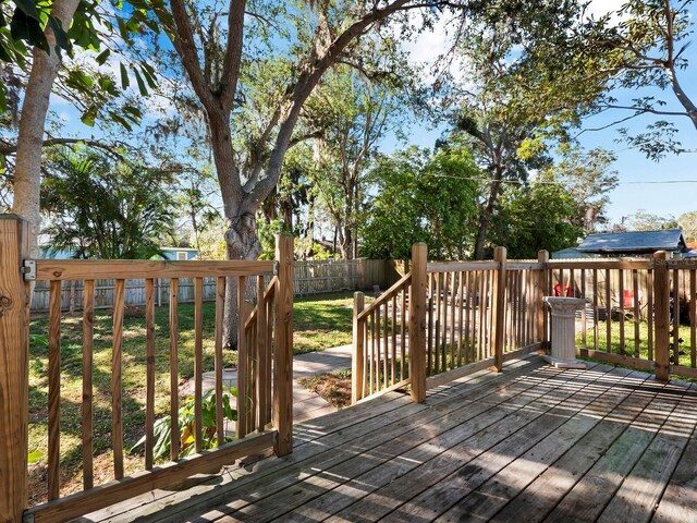 deck featuring a lawn