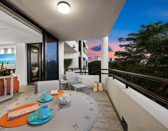 view of balcony at dusk