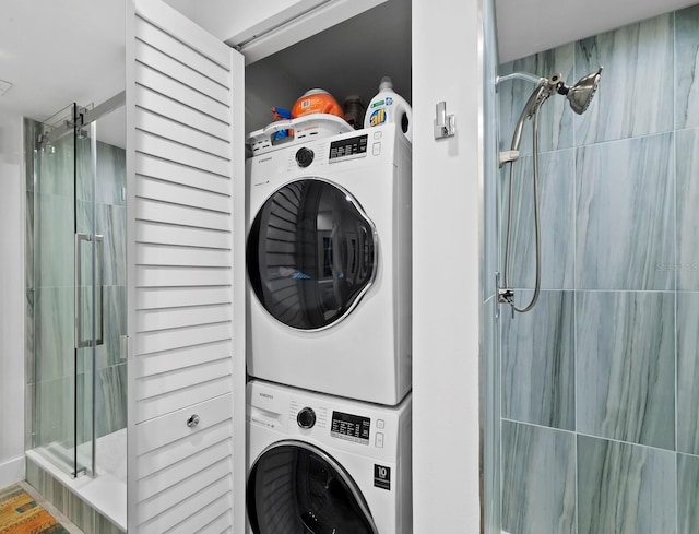 washroom with stacked washer / drying machine