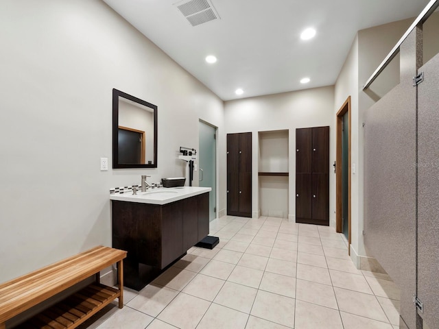 bathroom with tile patterned floors and vanity