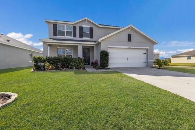 view of front of house with a garage and a front lawn