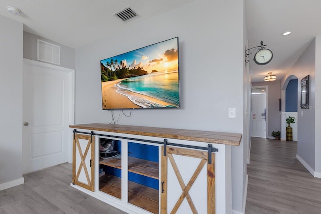 15404 Trinity Fall Way, Bradenton, FL 34212 - hall with wood finished floors and arched walkways