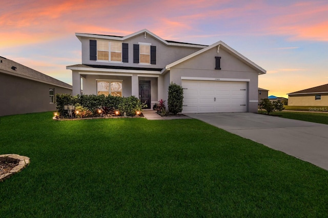 15404 Trinity Fall Way, Bradenton, FL 34212 - traditional-style house featuring stucco siding, a lawn, driveway, roof mounted solar panels, and a garage