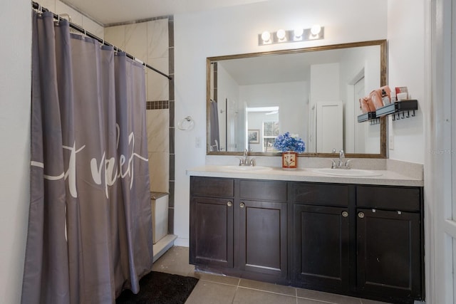 15404 Trinity Fall Way, Bradenton, FL 34212 - bathroom with tile patterned floors, a tile shower, and double vanity