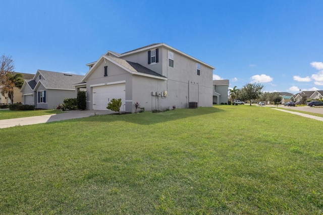 15404 Trinity Fall Way, Bradenton, FL 34212 - view of home's exterior featuring stucco siding, concrete driveway, a yard, and a garage