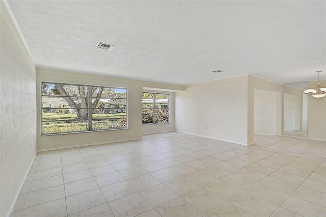 unfurnished room featuring a chandelier, crown molding, and light tile patterned flooring