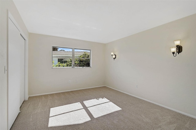 unfurnished bedroom featuring light colored carpet