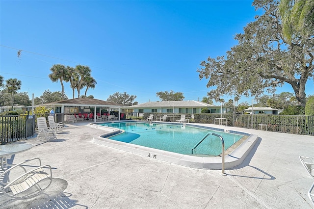 view of swimming pool with a patio