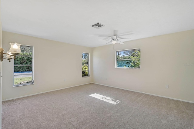 carpeted empty room with ceiling fan