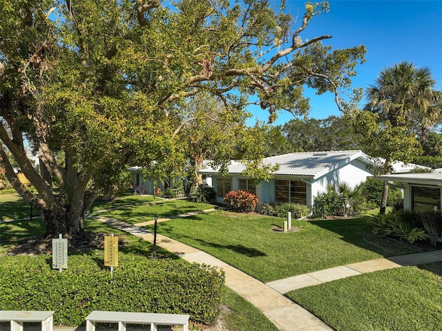 view of front of property with a front lawn