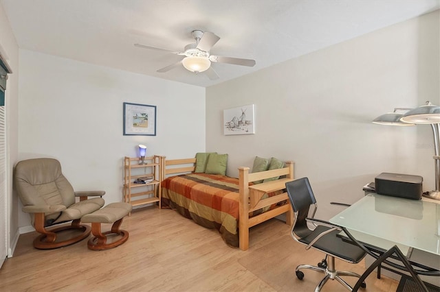 bedroom with ceiling fan and light wood-type flooring