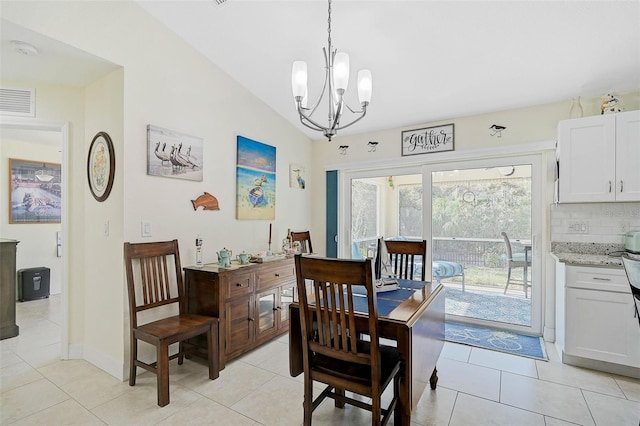 dining area featuring light tile patterned floors, lofted ceiling, and a notable chandelier